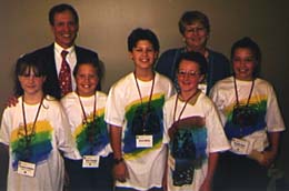 Chris Helod, his wife, and five students at NECC